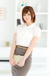 Beautiful young businesswoman working in office