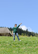 Photo: Woman standing in a green field pointing Woman standing in a green field pointing
