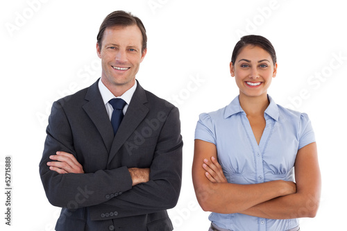 Photo: Smiling co workers standing next to each other Smiling co workers standing next to each other