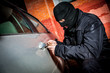 Car thief in a mask.