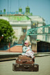 Vintage looking picture of small girl with luggage at the railwa