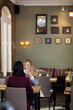 Happy Young Woman Having Coffee With Friend