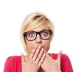 Surprised woman covering with hands her mouth