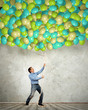Adult man pulling a rope with balloons