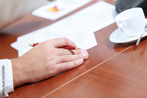 Photo: Hands of businessman laying on table Hands of businessman laying on table