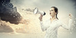 Businesswoman screaming in megaphone