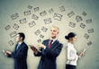 Three Businesspeople With Tabl...