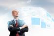Foto: Confident businessman smiling Confident businessman smiling
