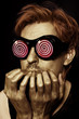 Photo: Man with metal makeup in strange glasses Man with metal makeup in strange glasses