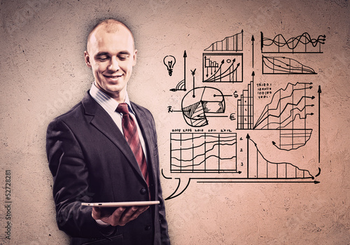Photo: Businessman with ipad in hands Businessman with ipad in hands
