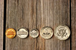 US cent coins over wooden background