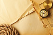 Photo: Antique compass and rope over old map Antique compass and rope over old map