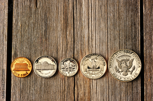 Photo: US cent coins over wooden background US cent coins over wooden background