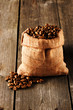 Photo: Coffee beans in bag on table Coffee beans in bag on table