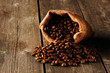 Photo: Coffee beans in bag on table Coffee beans in bag on table