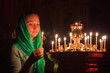 Girl with a candle in the Orthodox Church.