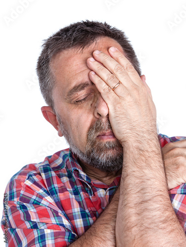 Photo: Middle age man suffering from a headache Middle age man suffering from a headache