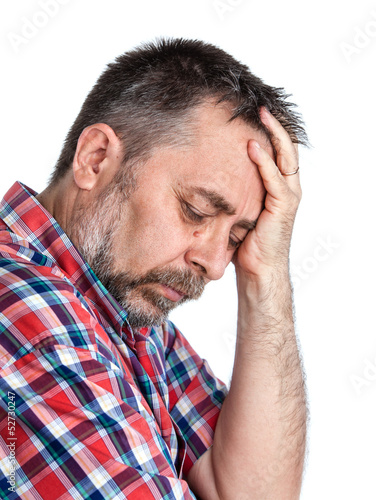Photo: Middle age man suffering from a headache Middle age man suffering from a headache