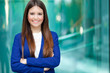Beautiful young female executive in a modern setting