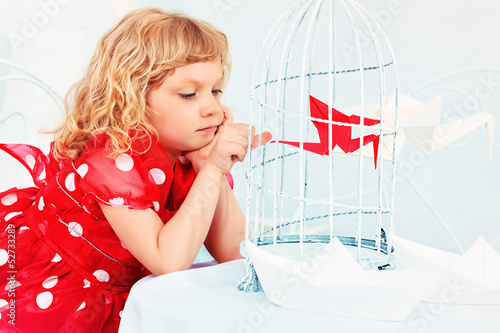 Photo: little bird in a cage little bird in a cage