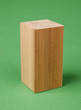 wooden geometric shapes on a green background