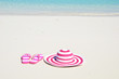 Flip-flops and hat on the beach