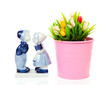 Typical Dutch souvenir in Delft blue and plastic tulips in bucke