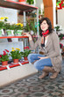   woman in floral store