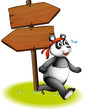 A panda beside the wooden arrowboards