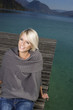 Beauty portrait of woman sitting on a pontoon
