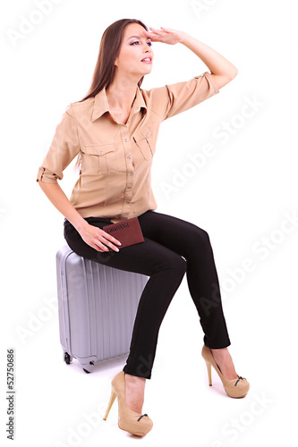 Photo: Young businesswoman with suitcase isolated on white Young businesswoman with suitcase isolated on white