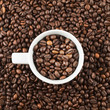 Ceramic cup of coffee beans