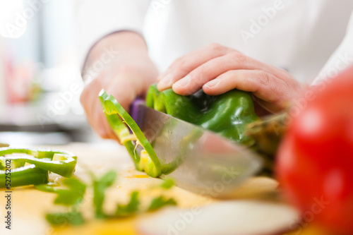 Photo: Chef at work in his kitchen Chef at work in his kitchen