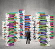 man looking at books