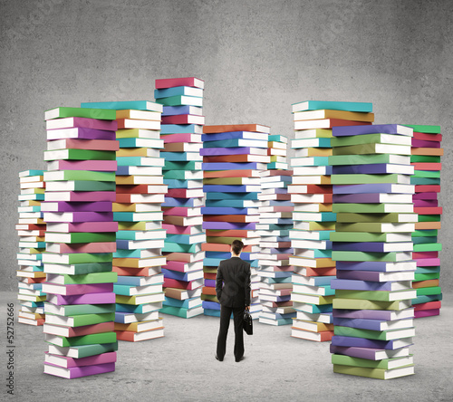Photo: man looking at books man looking at books