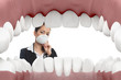 Female dentist looking worried into mouth