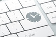 Timeline concept: Clock on computer keyboard background