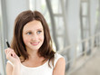 Foto: Portrait of smiling beautiful young businesswoman Portrait of smiling beautiful young businesswoman