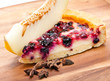 Photo: Cheesecake with berries and a fresh melon on a wooden tray Cheesecake with berries and a fresh melon on a wooden tray