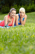 Photo: Portrait of two fitness woman having fun in summer environment Portrait of two fitness woman having fun in summer environment