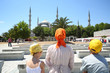 Mother, son and daughter going to Mosque