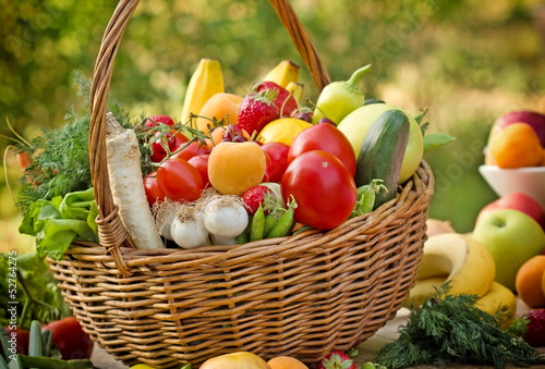 Photo: Fresh fruits and vegetables in the wicker basket Fresh fruits and vegetables in the wicker basket