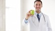 Video: doctor with green apple in hands doctor with green apple in hands