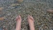 Pair of feet in cool water