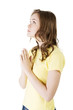 Young pretty caucasian girl praying