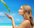 Photo: woman with green leaf woman with green leaf