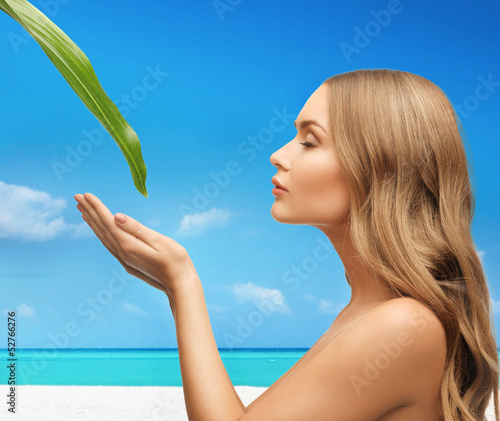 Photo: woman with green leaf woman with green leaf