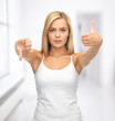 woman with thumbs up and down