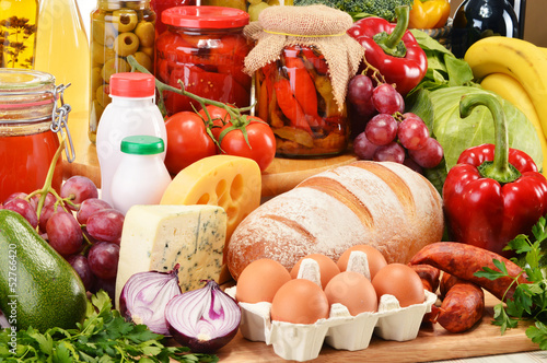 Photo: Assorted grocery products including vegetables fruits wine bread Assorted grocery products including vegetables fruits wine bread
