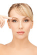 woman touching her face skin